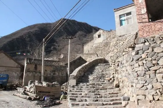 Walk up the west hillside stone houses.