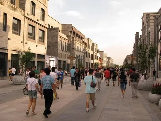 Walking along the street.