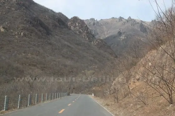 We are driving along the asphalt road in the valley.