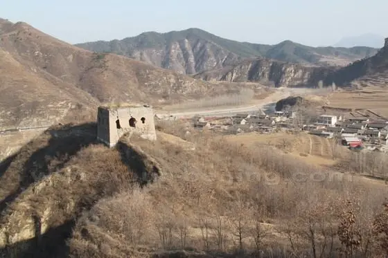 We climb past the first fort and again have a glimpse of the village below.