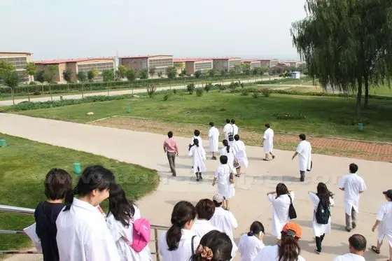 We have to wear white gowns before visiting egg packaging plant.