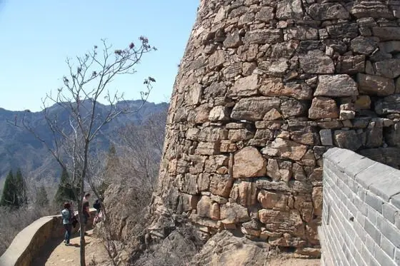 We hike past the yellow tower built of loose slate