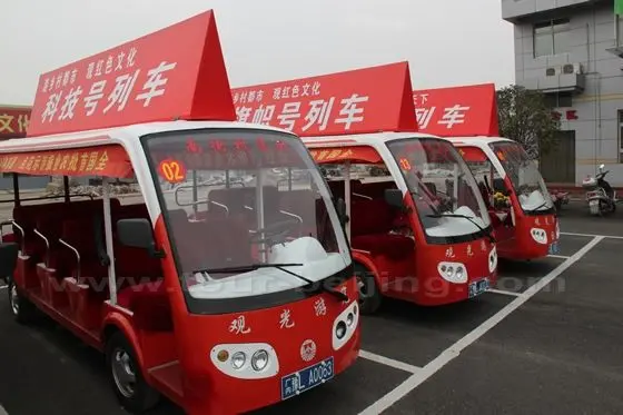 You will be arranged sitting in an electric car to tour around.