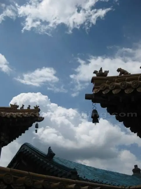 Blue sky, white clouds and the temple eaves