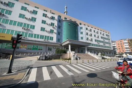 You get off the 15th stop pf Beidajie ( North Street ) by the side of the large governmental building.