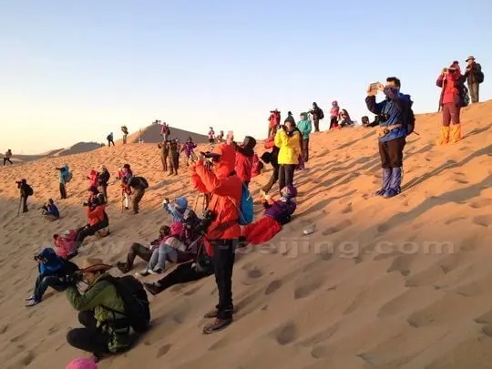 Get up early to catch the sunrise over the desert