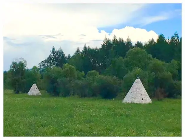 The cone shaped house covered with birch bark is the temporary house for Evenki live in forests