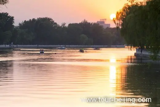 Boating on the water surface bright with golden rays