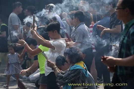 The Buddha appears in incense smoke