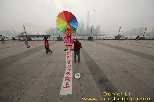 Proudly showing his kite.