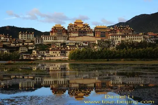 Ganden Sumtseling Monastery is in sunset glow