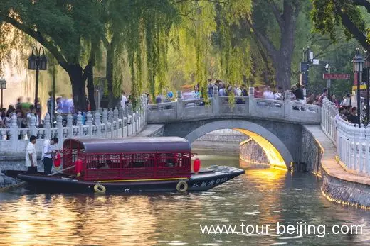 Silver Ingot Bridge spanning Houhai and Qianhai glowing with shining sunset.