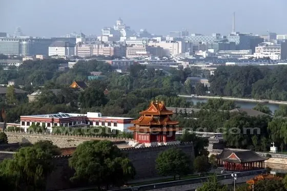 the massive Forbidden City looking brilliantly under a radiant rising sun.1