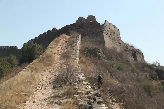 we have to get off the wall and hike along a mountain path by the wall