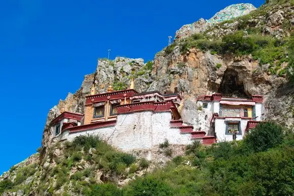 The temple houses are built on the hillside accommodating the caves.
